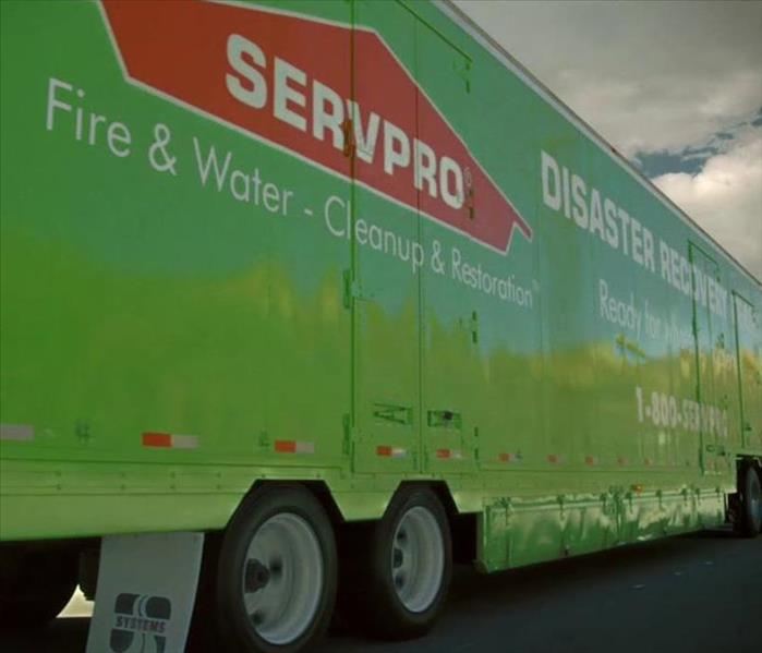 Green SERVPRO truck on road 