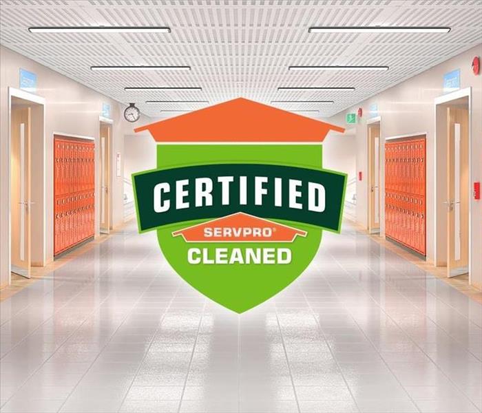 Servpro logo with writing on it. lockers in the background 